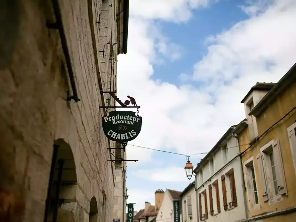 Chablis street with winemaker's sign