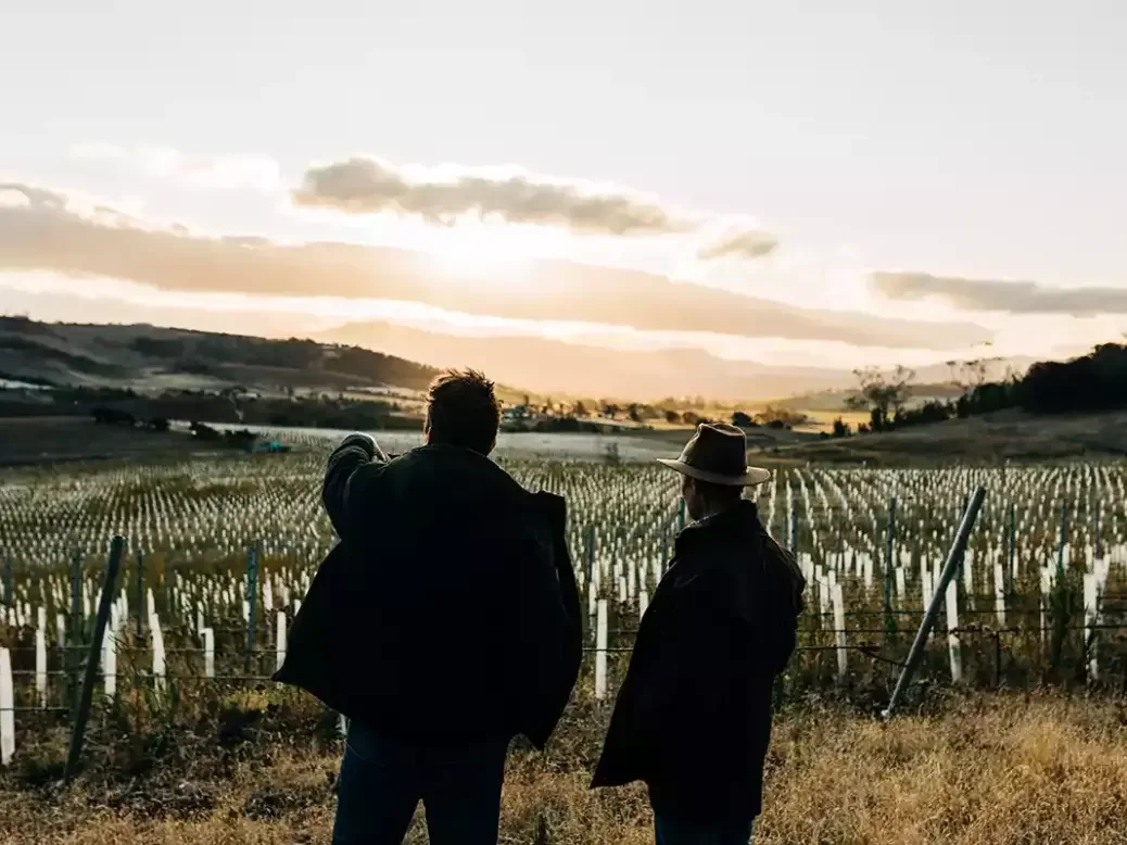 Nick Glaetzer and Gerald Ellis looking out over the Glaetzer-Dixon vineyard in Tasmania.